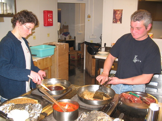 [20050317_4_CrepesJeanClaire.jpg]
Kitchen at the Antarctic station of Dome C. Claire and Jean preparing some crêpes.