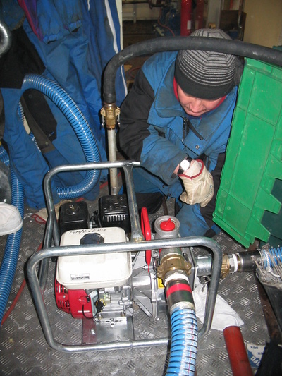 [20050511_41_MotoPump.jpg]
Jean monitoring the motopump sending water through the fire hose during a drill. The input water comes directly from a tank outside.