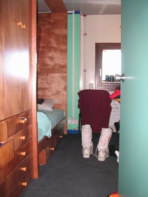 [BedRoom.jpg]
My bedroom in Concordia, with the top bed raised, before I have the time to settle in better and put pictures on the walls.