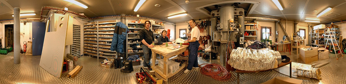 [PanoMainWorkshop.jpg]
This is the main workshop where all kind of technical activities are performed. Here Jeff, Michel and Roberto having a drink after the spring cleaning session.