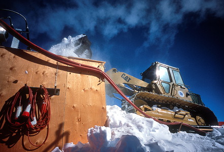 [CatFillingMelter2.jpg]
Loading the melter in summer. For the winter we weren't sure that the Cat would operate in extreme cold, so we had a pile of shovels ready...