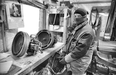 [JeanGarage-BW.jpg]
Jean in the garage, working on a snowmachine part and trying not to mind the cold. That's what the calendar girl is for.