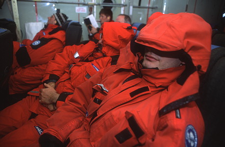 [SleepingOnC130.jpg]
Passengers sleeping during the flight. The noise level on board the aircraft is so high, it precludes any conversation. You either read or sleep. Or watch out the window in the last hour of the flight if you are fortunate enough to have one handy.