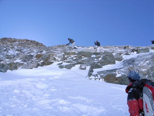 [20060406_0011040_DiceyJump.jpg]
A dicey jump off a small cliff barring the descent of a couloir at La Grave.