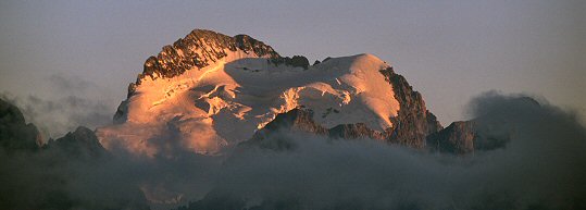 [EcrinsSunset.jpg]
La Barre des Ecrins seen from Roc Noir de Combeynot, rising above the evening fog.