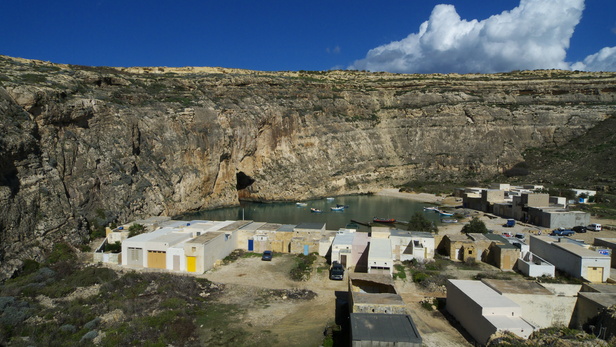 [20101030_141735_InlandSea.jpg]
The 'inland sea' at Dwejra point. A crack in the cliff let the boats in and out. The climbing on the right of the beach is easy.