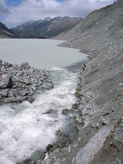 [20051226_0357_HookerHut.jpg]
Jens walking the unstable side of Hooker lake, new access to the Copland pass.