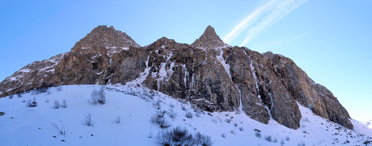 [20070204-VallonDiableIcePano_.jpg]
Some ice in the Vallon du Diable. 2007 was a very poor year for ice climbers. Virtually no ice anywhere in the Alps, the little ice to be found there was wet, unstable and crowded. Here in this remote and high valley there are normally 80 formed icefalls. That day you were lucky to find 5 that were climbable. And all of it was wet. 'Les larmes du chaos' is almost hidden on the left.