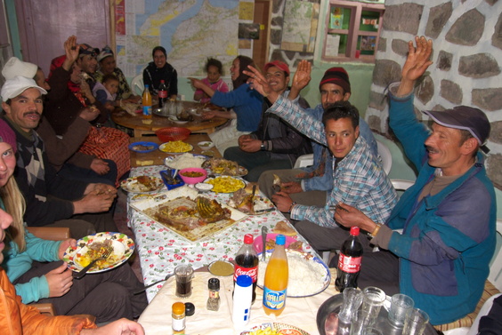 [20120504_230254_Mechoui.jpg]
Said's extended family at the table with us. For the occasion there's coke, juices and fries on the table as well. And Alex's nose on the left.