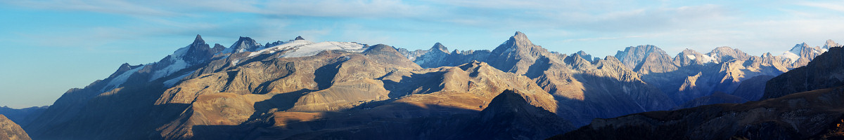 [20071023_180611_MeijePano_.jpg]
The Ecrins range as seen from the Taillefer in autumn. The Meije is the leftmost summit. The small but characteristically shaped gash 2/3 into the image is recognizable as the Coup de Sabre, a classic couloir between Pic Sans Nom and Ailefroide. The large summit in the middle should be the Ecrins, but I can't really recognize it (maybe it's partially hidden by another minor peak, which is the reason why this peak was unknown until very late into the 19th century).