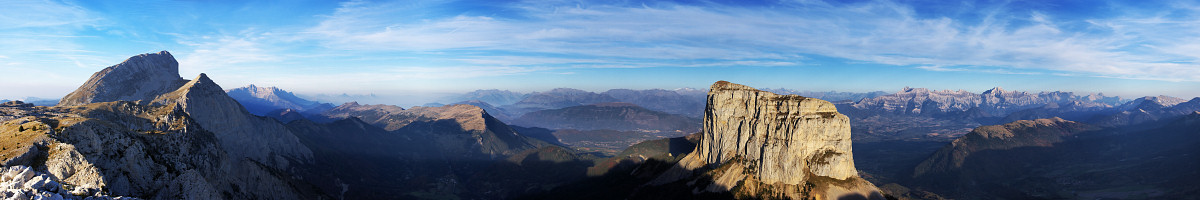 [20071016_175348_MtAiguillePano_.jpg]
Panorama taken from the edge of the Vercors plateau showing the Grand Veymont, highest summit of Vercors (2341m) and the distinctive Mt Aiguille (2087m). Grenoble is in the haze in the background between the two summits and the Devoluy is the range of mountains visible on the right.