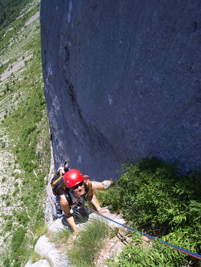 [20080628_123727_Gerbier.jpg]
Crux move on the Couloir en Virgule. As I grapple desperately to the fragile saplings for lack of better holds, I feel a sling underneath and pull cautiously on it... until I can use it to drag myself up. Good thing I was being cautious as it is neck-tied to a pair of pitons hammered together into a flaring hole. Of course for Jenny I remove it to see how the move is supposed to be done. Can you believe she yelled at me afterwards when she found out about the sling ?