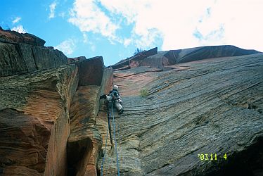 [ZionAngelCrux.jpg]
Starting the crux pitch in the left dihedral, before moving into the right one and traversing left again.