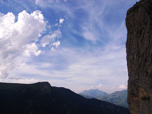 Tiny climber profiled on the huge face of the Gilardes