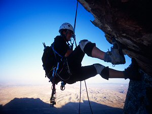 Jenny rappelling off the roof of Inti Watana (5.10) Red Rocks